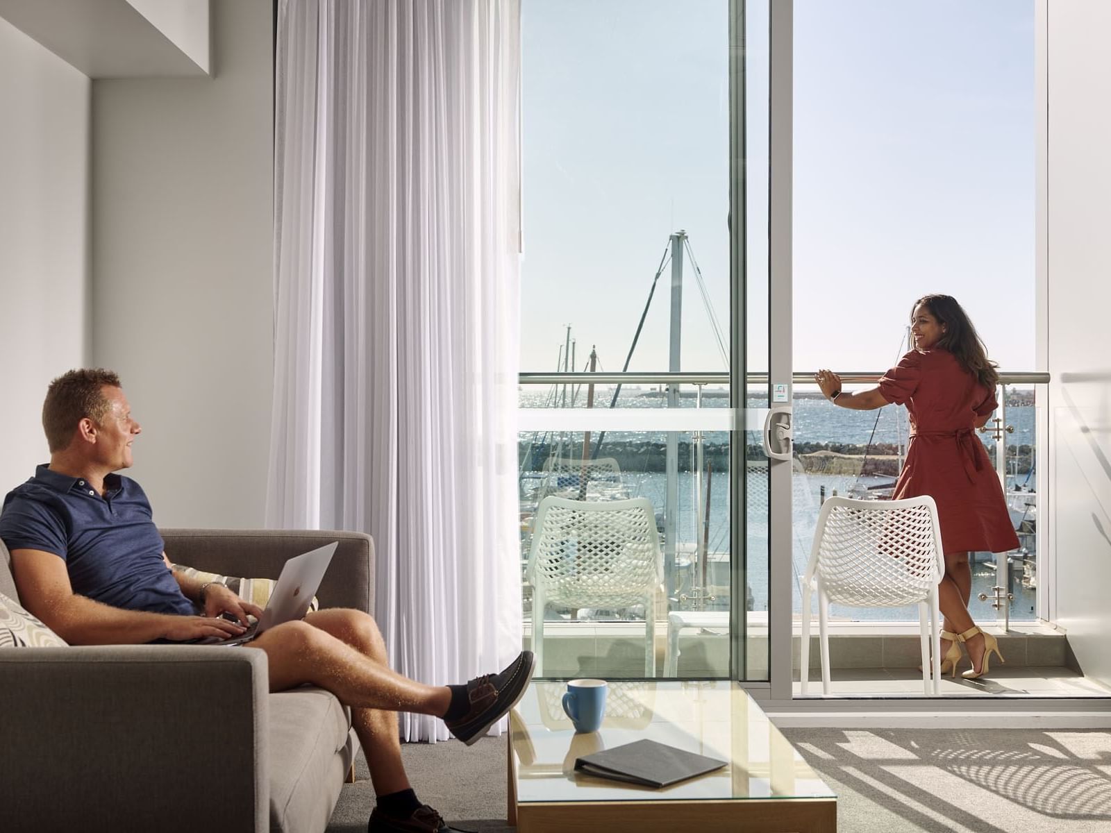 A couple in the living area in an apartment at Be Fremantle