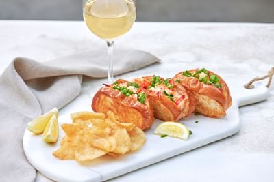Garlic bread served with a cocktail at Luxe Sunset Boulevard Hotel