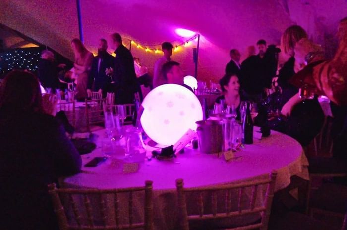 Christmas parties in Wokingham featuring glowing table centre at Easthampstead Park