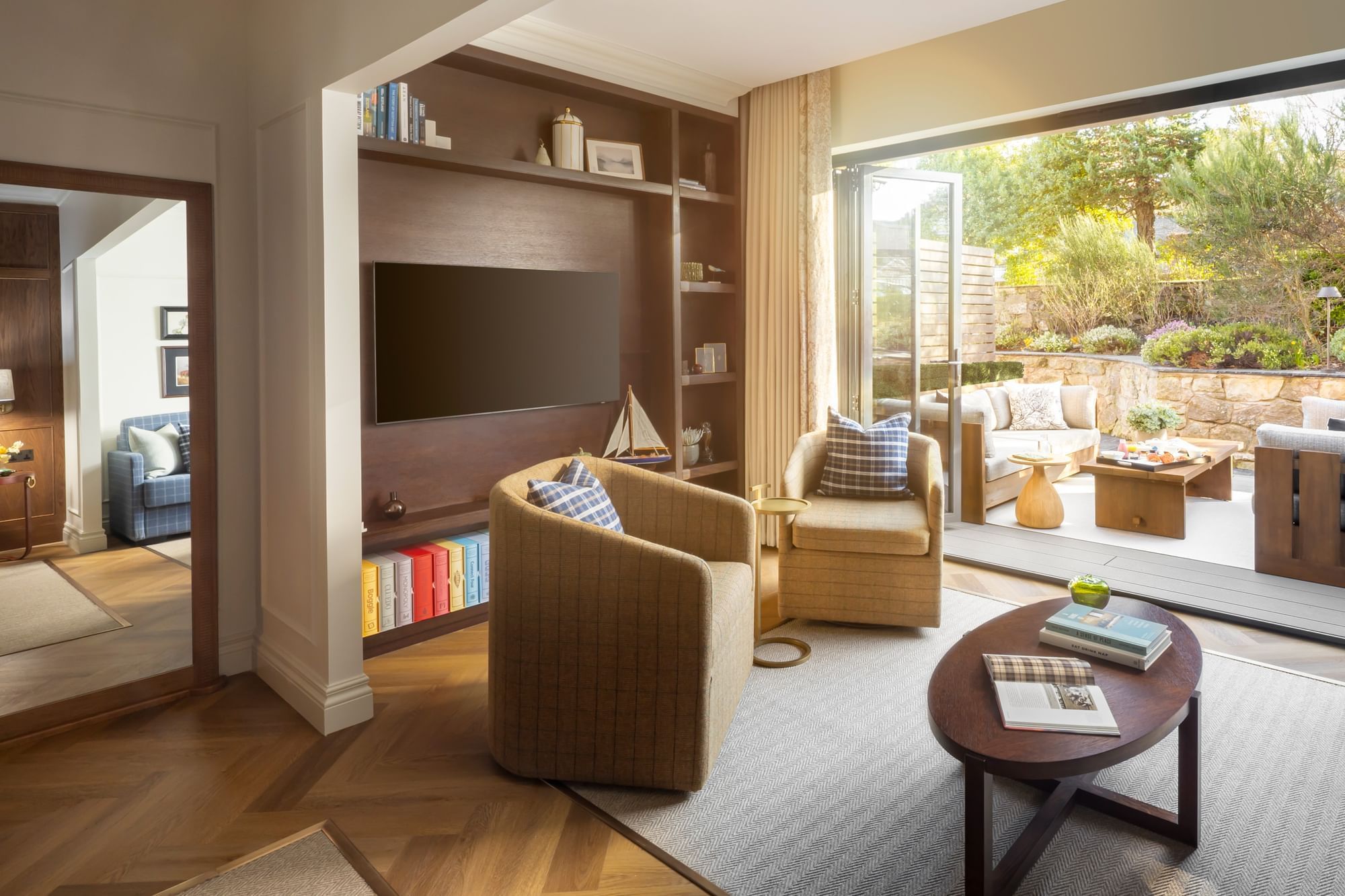 Suite with Garden Terrace TV lounge, with two chairs and patio doors leading to a yard at Seaton House