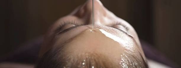 Lady receiving an oil treatment in crown spa at Crown Hotels
