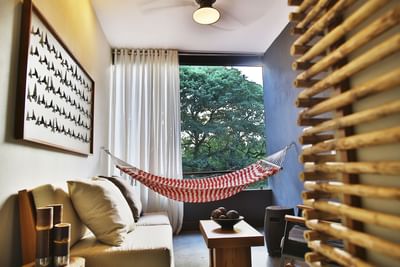 Resort Suite 2 Queen Beds with a hammock, art on the wall and garden view at El Mangroove Hotel