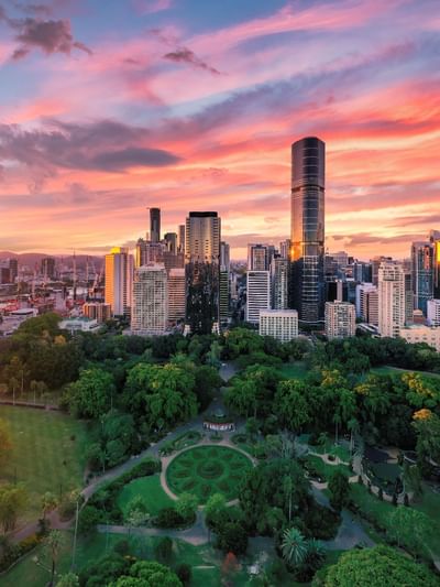 City skyline at sunset with Brisbane City Botanic Gardens near Sofitel Brisbane Central
