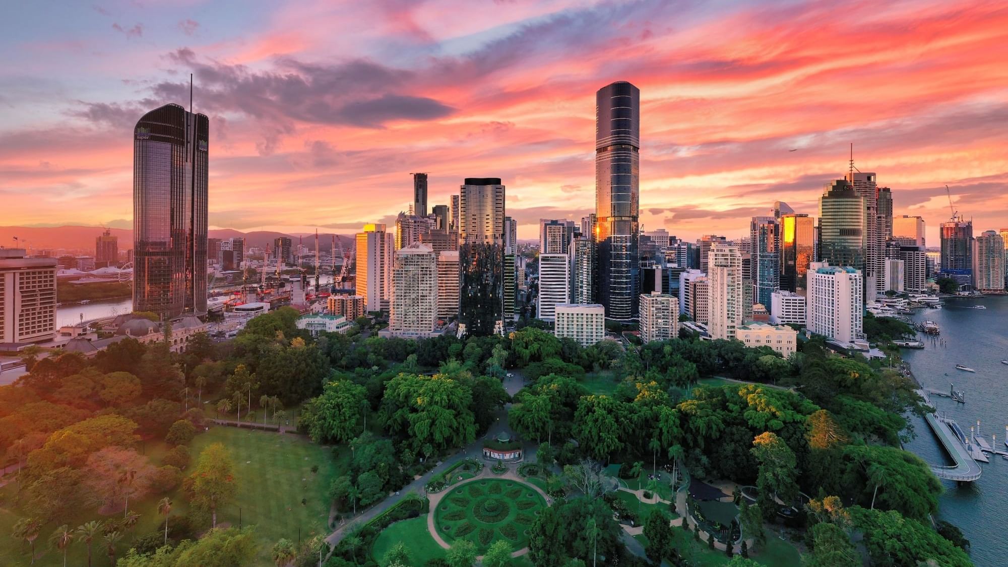 City skyline at sunset with Brisbane City Botanic Gardens near Sofitel Brisbane Central