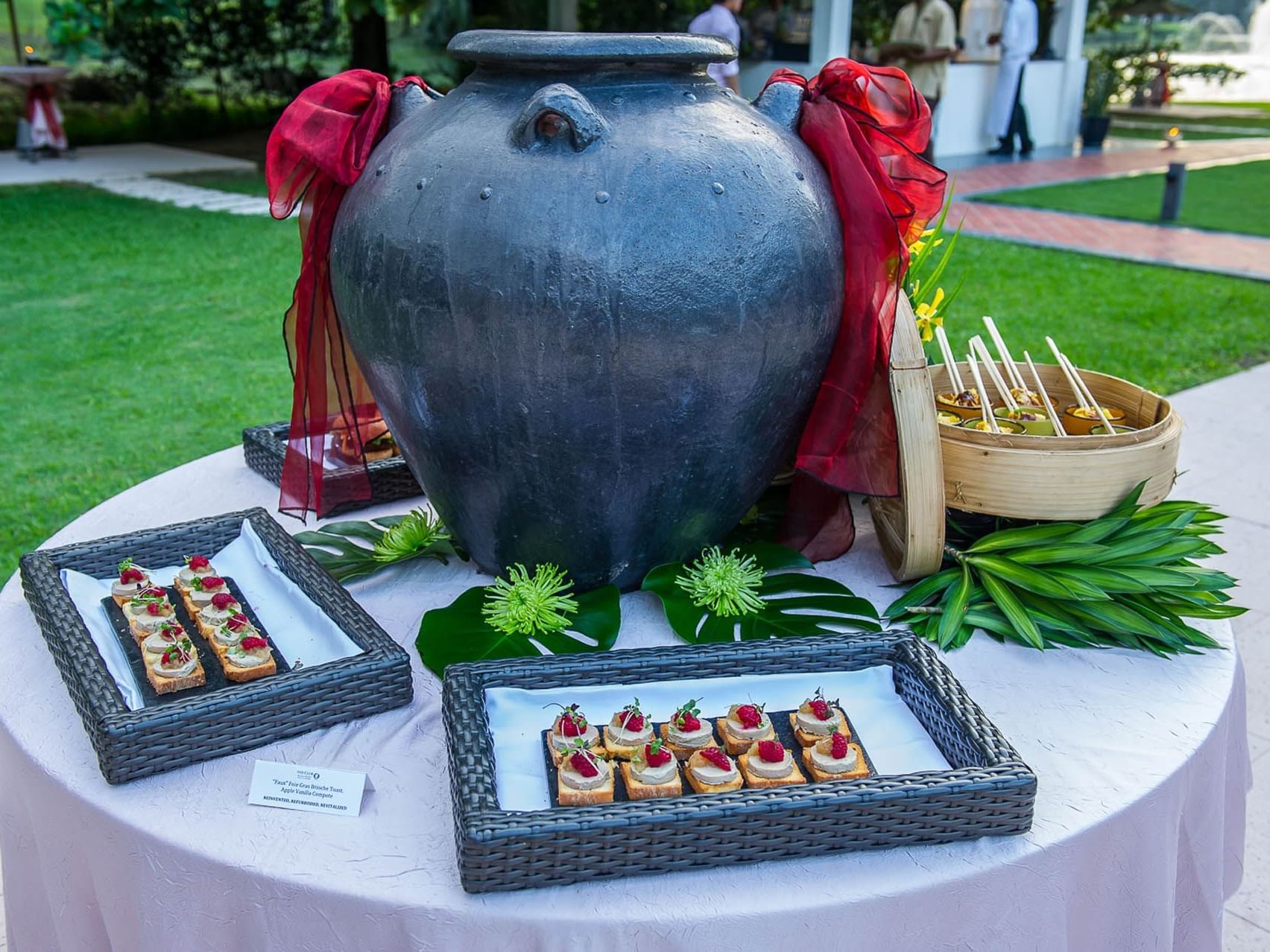 Appetizers and siders served on a table outdoors featuring the catering service at Saujana Hotel Kuala Lumpur