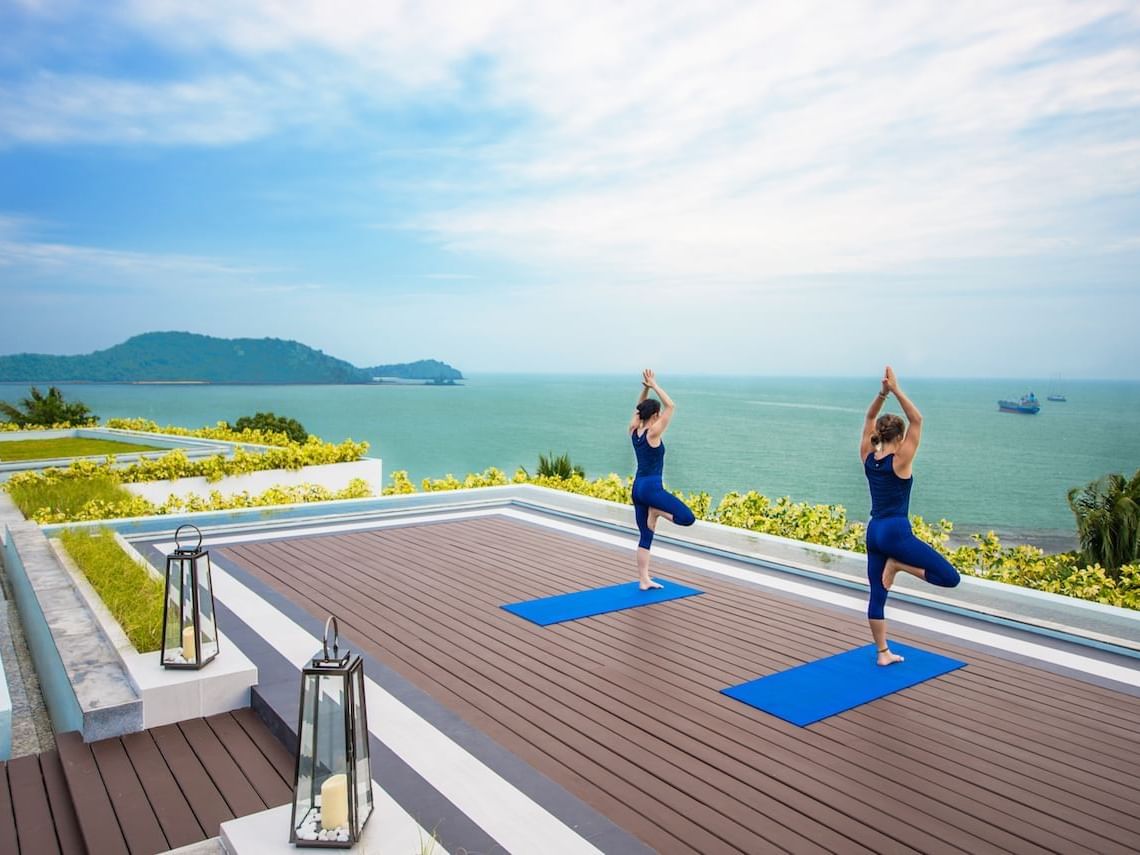 Guests doing yoga on the rooftop