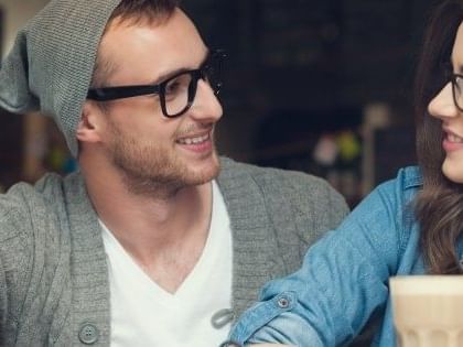 Close-up of a couple looking at each other in Kinzie Hotel