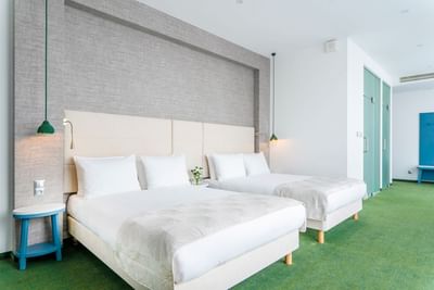 Double beds in the Suite at Metropol Hotel