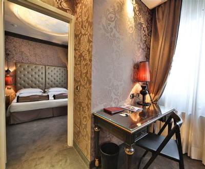Close up on a table by bedroom in Suite at Hotel Mozart Milan