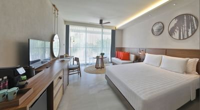 Room with king size bed and garden view at U Hotels