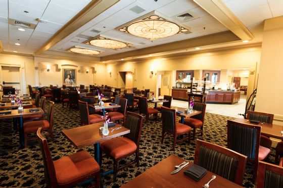 dining room with tables and carpet