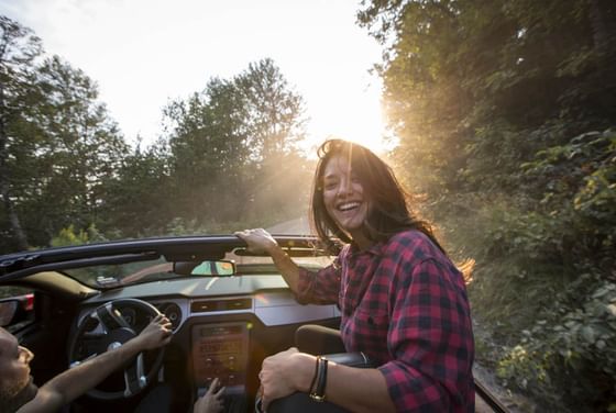 Jeep passenger looking back and smiling.