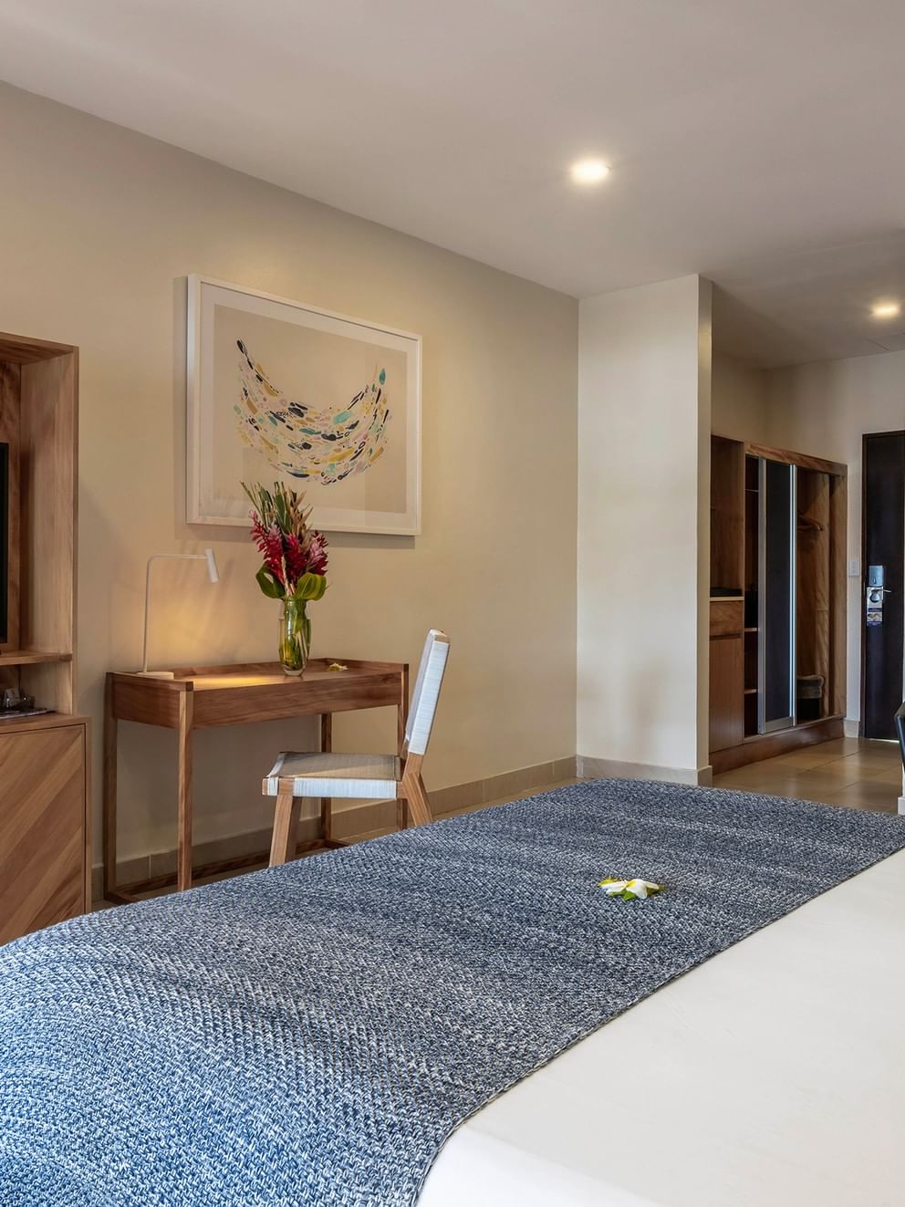 Lagoon Superior Room with bed, desk, couch, and TV at Warwick Le Lagon - Vanuatu, Efate.