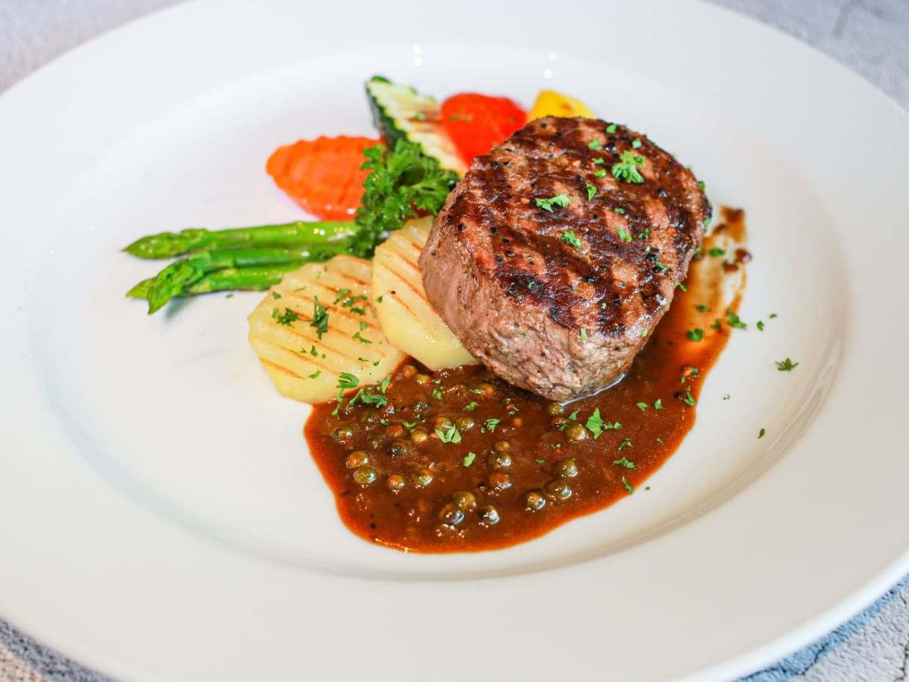 Steak & gravy dish served at Chatrium Hotels & Residences