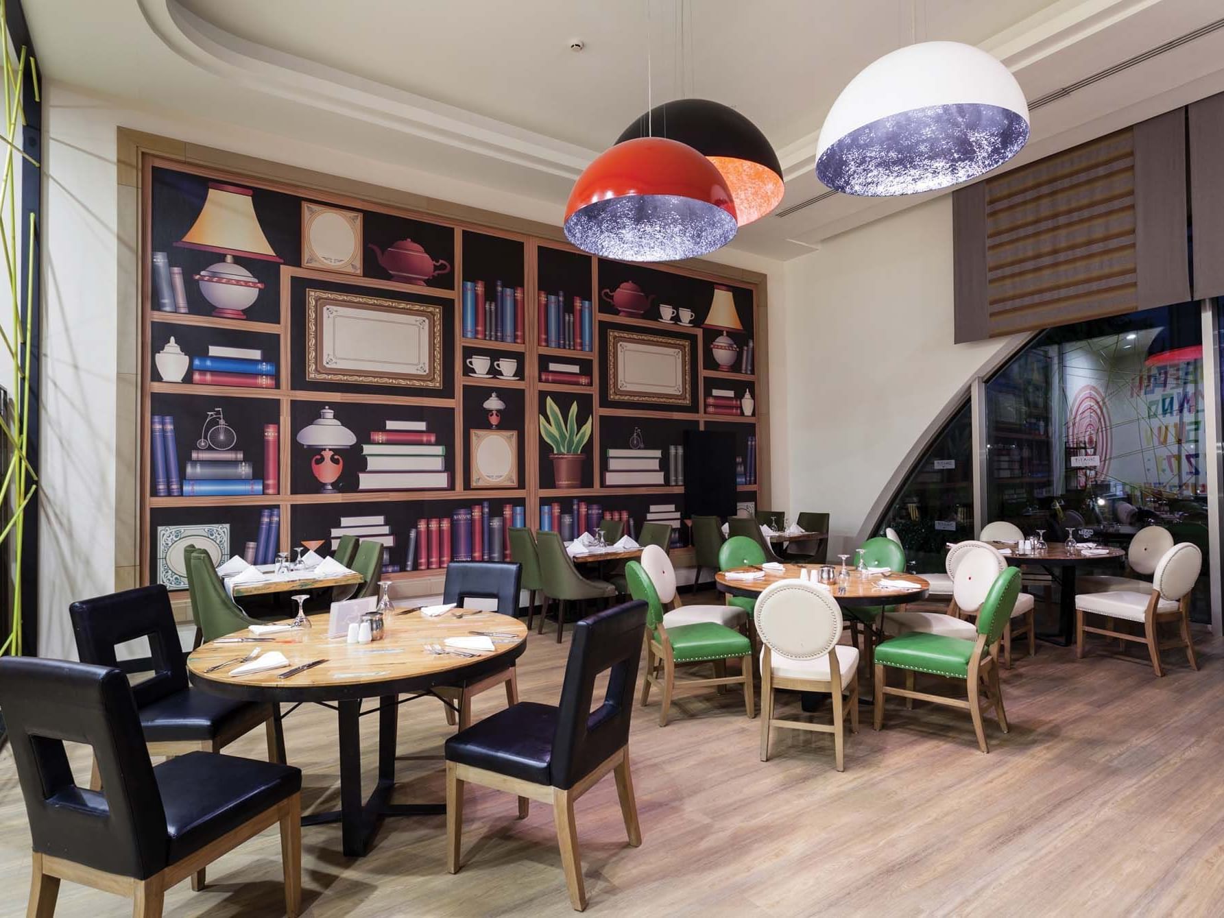 Dining tables arranged with chairs in Parkfora Main Restaurant at Titanic Deluxe Lara