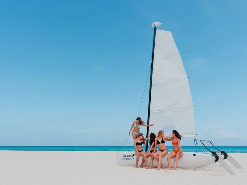 Group of friends having fun in Playa del Carmen near the Reef Coco Beach