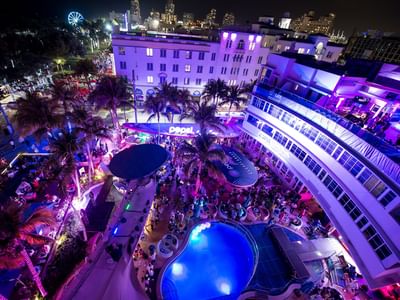 Top view of night pool party at Clevelander South Beach