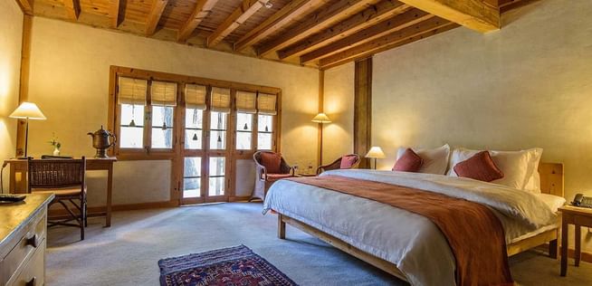 Bed and furniture in Garden Suite at Shigar Fort Residence