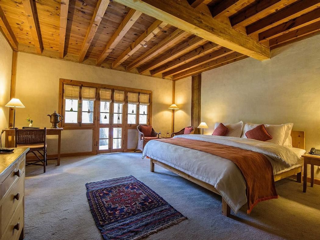 Bed and furniture in Garden Suite at Shigar Fort Residence