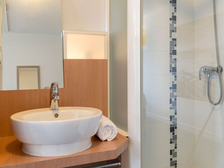 Bathroom vanity in bedrooms at Hotel Millau South
