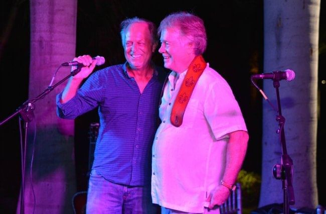 Two people performing on the stage at The Somerset On Grace Bay