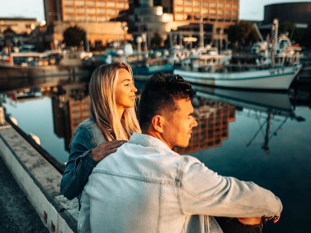 Couple watching sunrise by the dock at Grand Chancellor Hobart