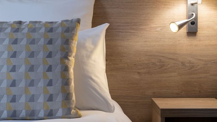 Closeup of Bedroom with pillows at Hotel de la Confluence