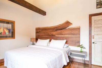 Comfy bed, pillows & furniture in a residence in Retro Suites Hotel