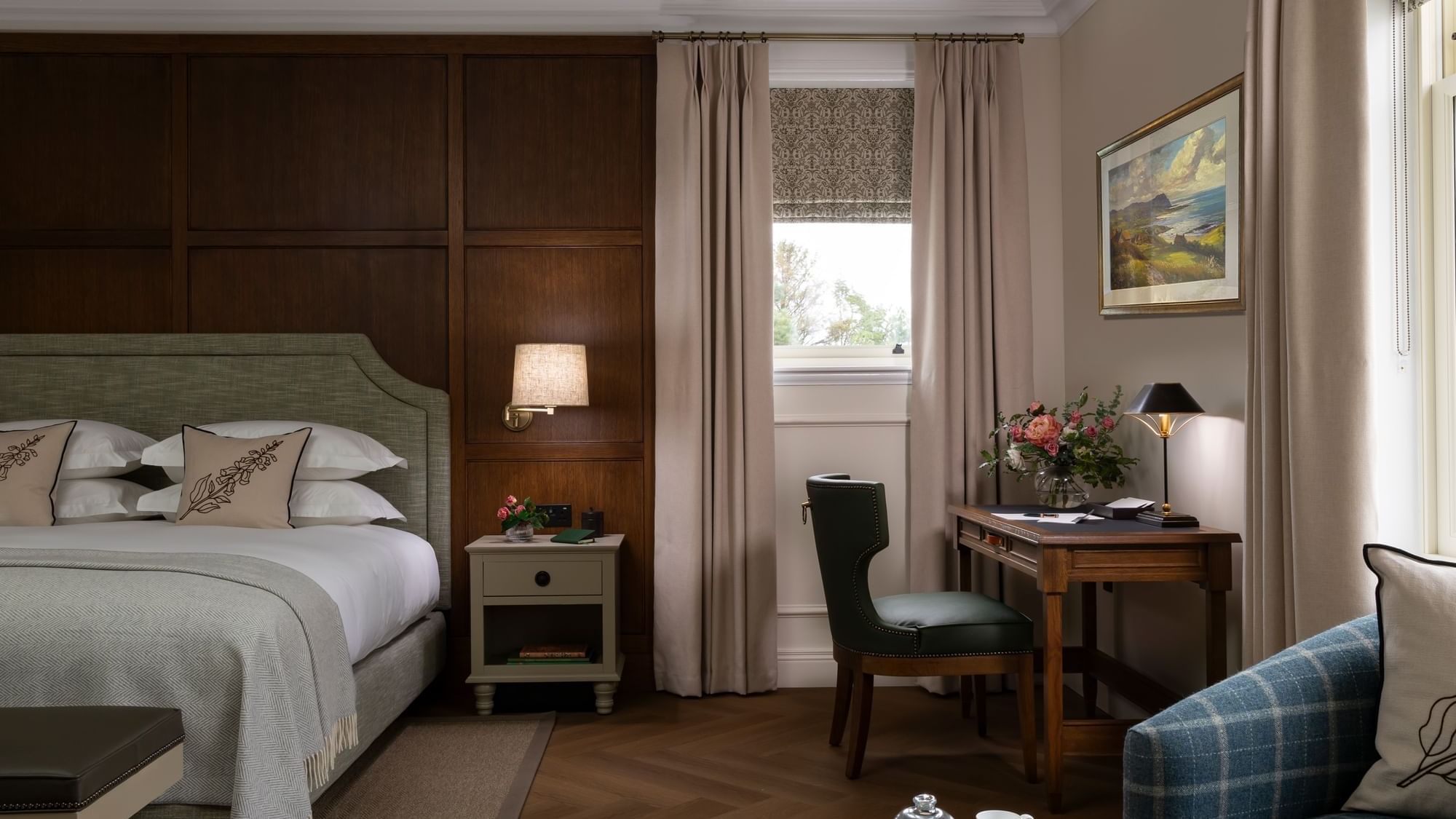 Suite with writing desk and seating area