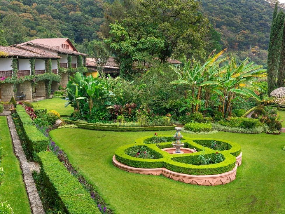 Fountain & trees in Casa Mariposa Garden at Hotel Atitlan
