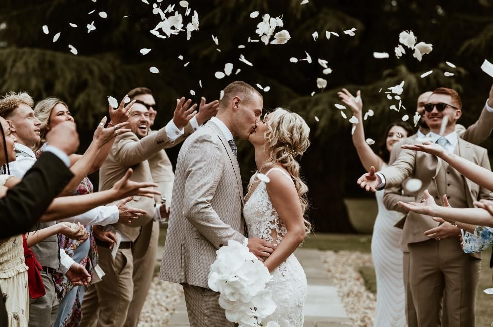 Outdoor wedding confetti shot at Easthampstead Park one of the best wedding venues in Berkshire