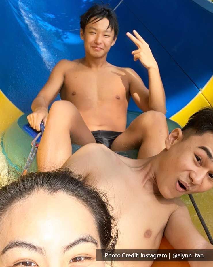 A group of people were taking a picture while sliding down the water tube at Escape Penang - Lexis Suites Penang