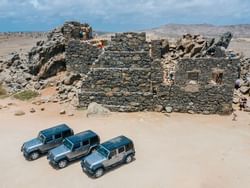Top view of jeeps parked by the Bushiribana Ruins near Passions on the Beach