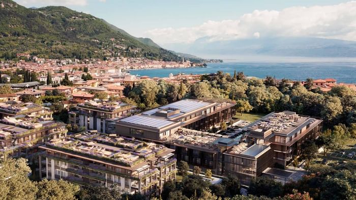 Aerial view of a hotel complex with rooftop terraces and solar panels at Falkensteiner Group