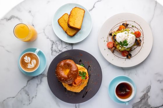 Breakfast bagels, avocado toast, juice & latte served at Melbourne Hotel Perth