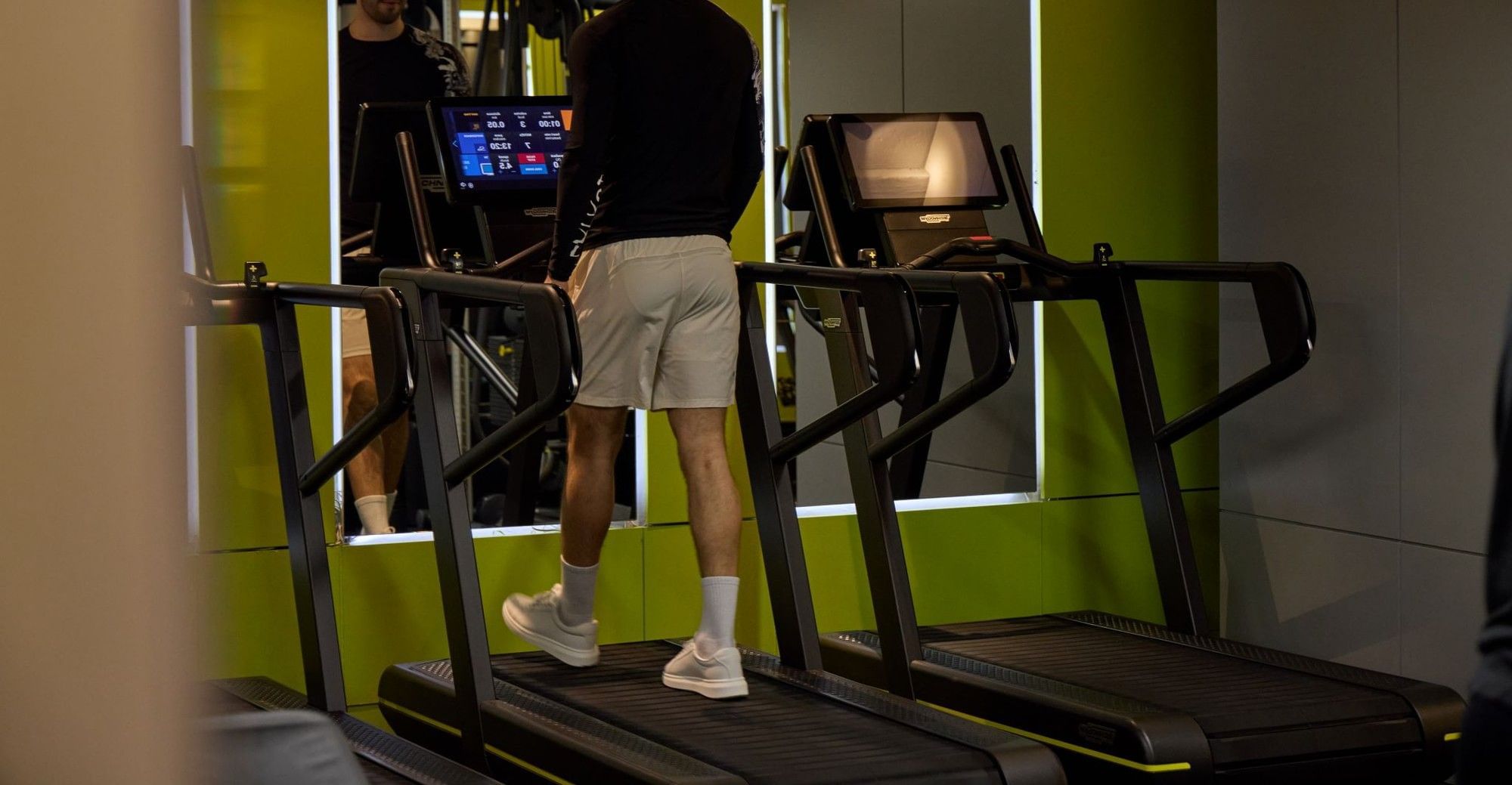 Man using treadmill in the May Fair gym 