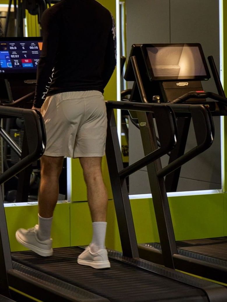 Man using treadmill in the May Fair gym 