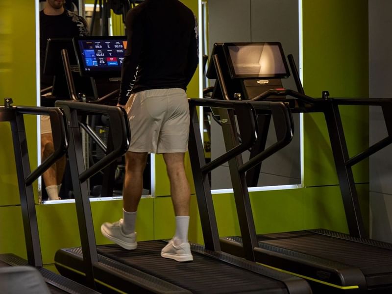 Man using treadmill in the May Fair gym 