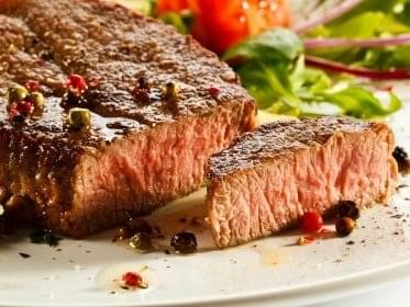 Close-up of steak dish at Gene & Georgetti's near Kinzie Hotel