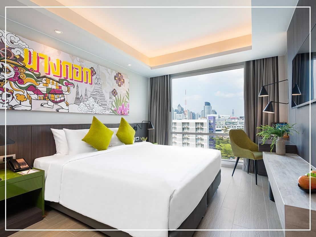 King bed in Deluxe Room at Maitria Hotel Rama 9 Bangkok