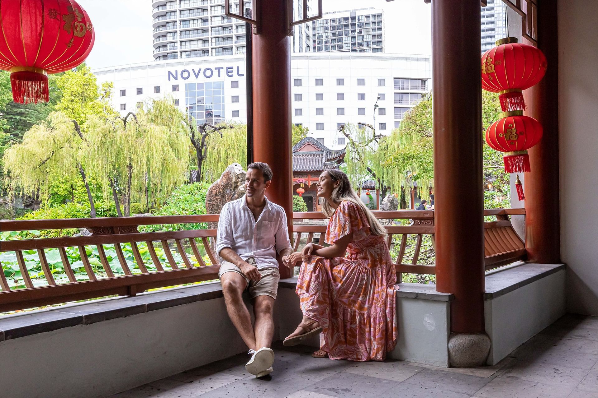 Couple enjoying a garden view at Novotel Sydney Darling Square