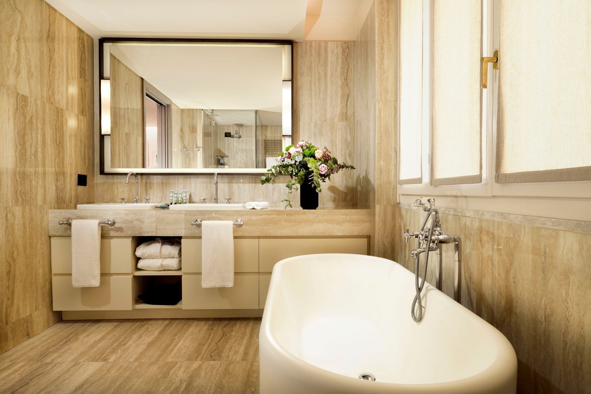 Bathroom interior with amenities & vanity in Deluxe Suite at Margutta 19