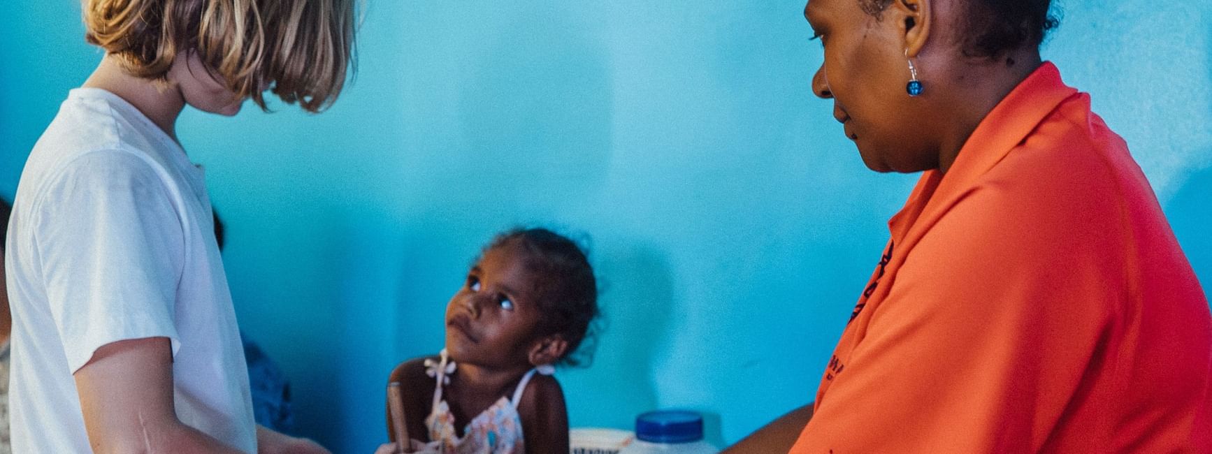 Woman and children in a cooking activity at Funtastik Kids Club at Warwick Le Lagon Efate