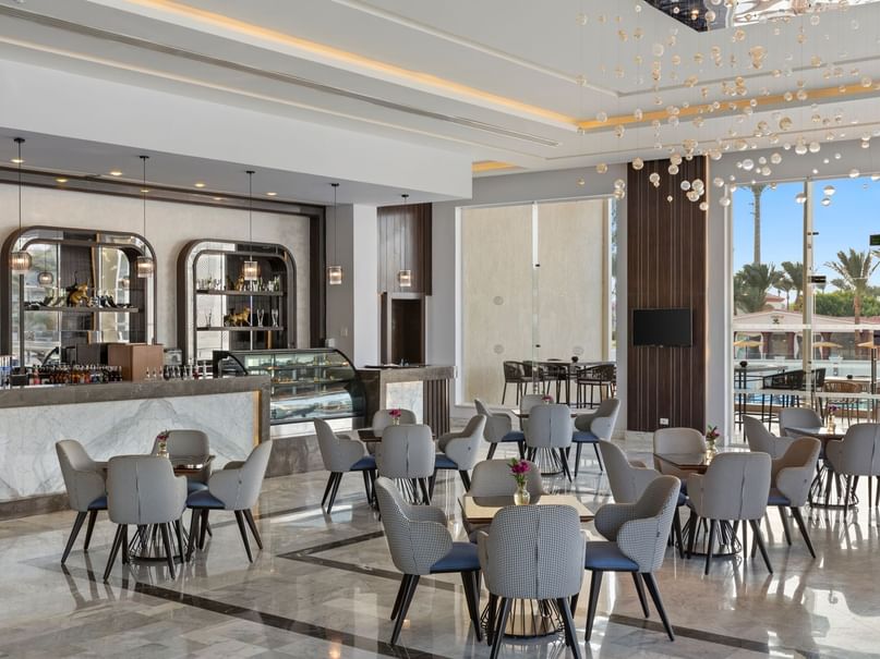 Interior view of piano bar table set up at pickalbatros hotels