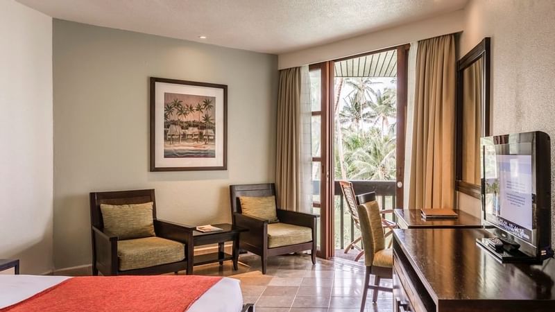 Lounge area & work desk in Warwick Deluxe Room at Warwick Fiji