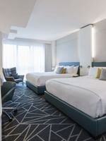 Loft Suite 2 King Beds with couch near window at Warwick Le Crystal Montreal