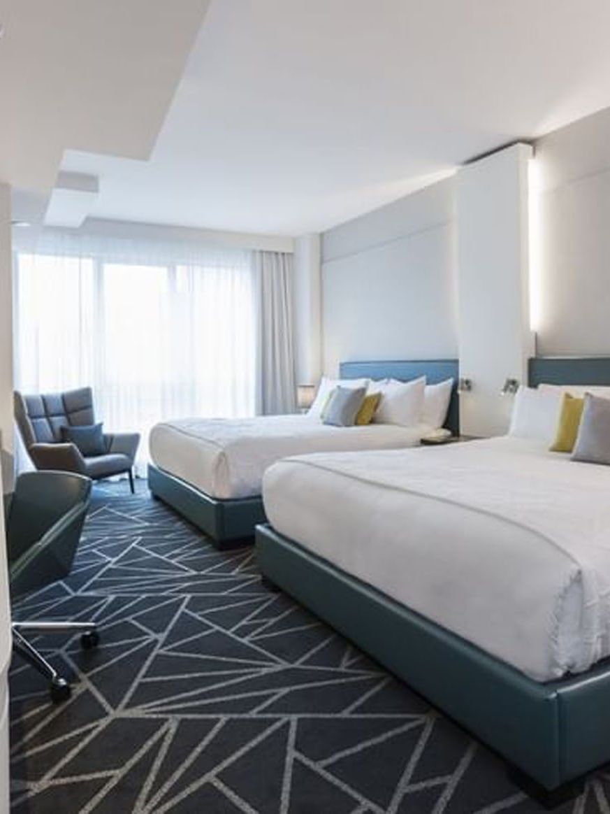 Loft Suite 2 King Beds with couch near window at Warwick Le Crystal Montreal