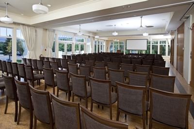 Meeting room with rows of chairs.