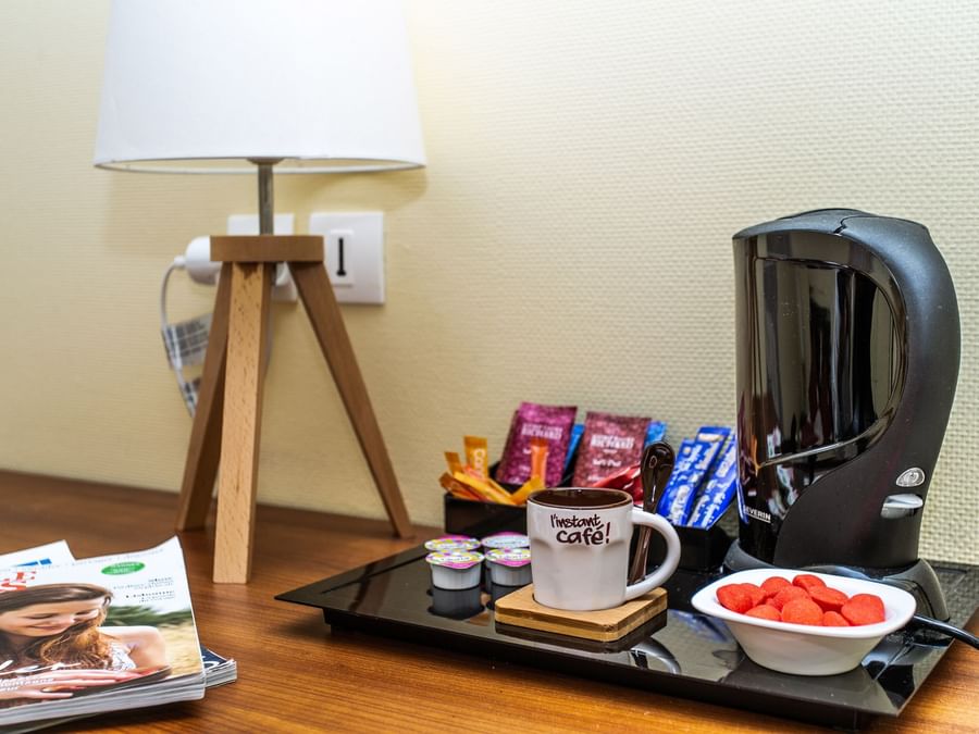 Coffee maker & some snacks on a table at Hotel Pic Epeiche