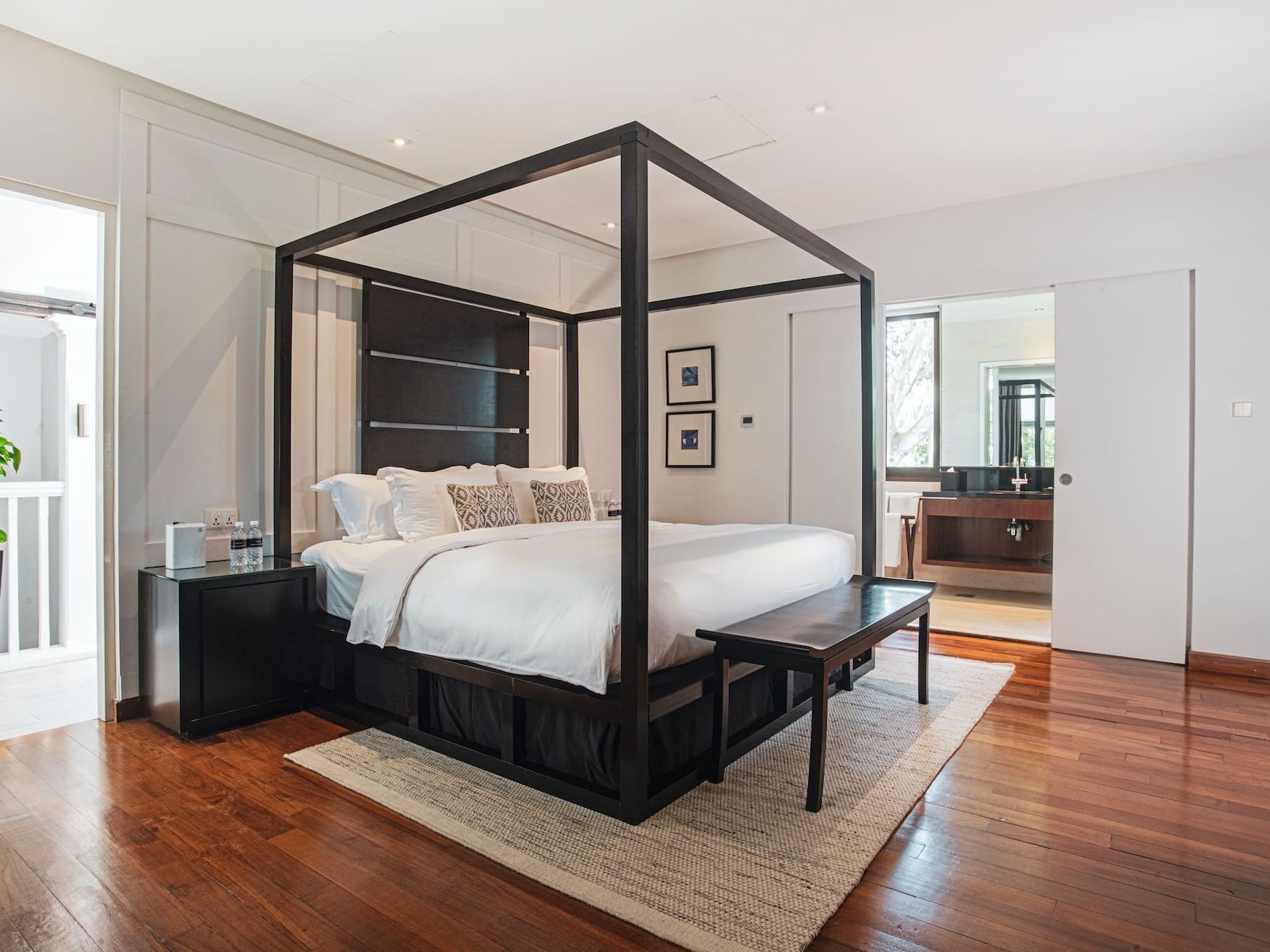 A spacious bedroom with a charming four-poster bed
